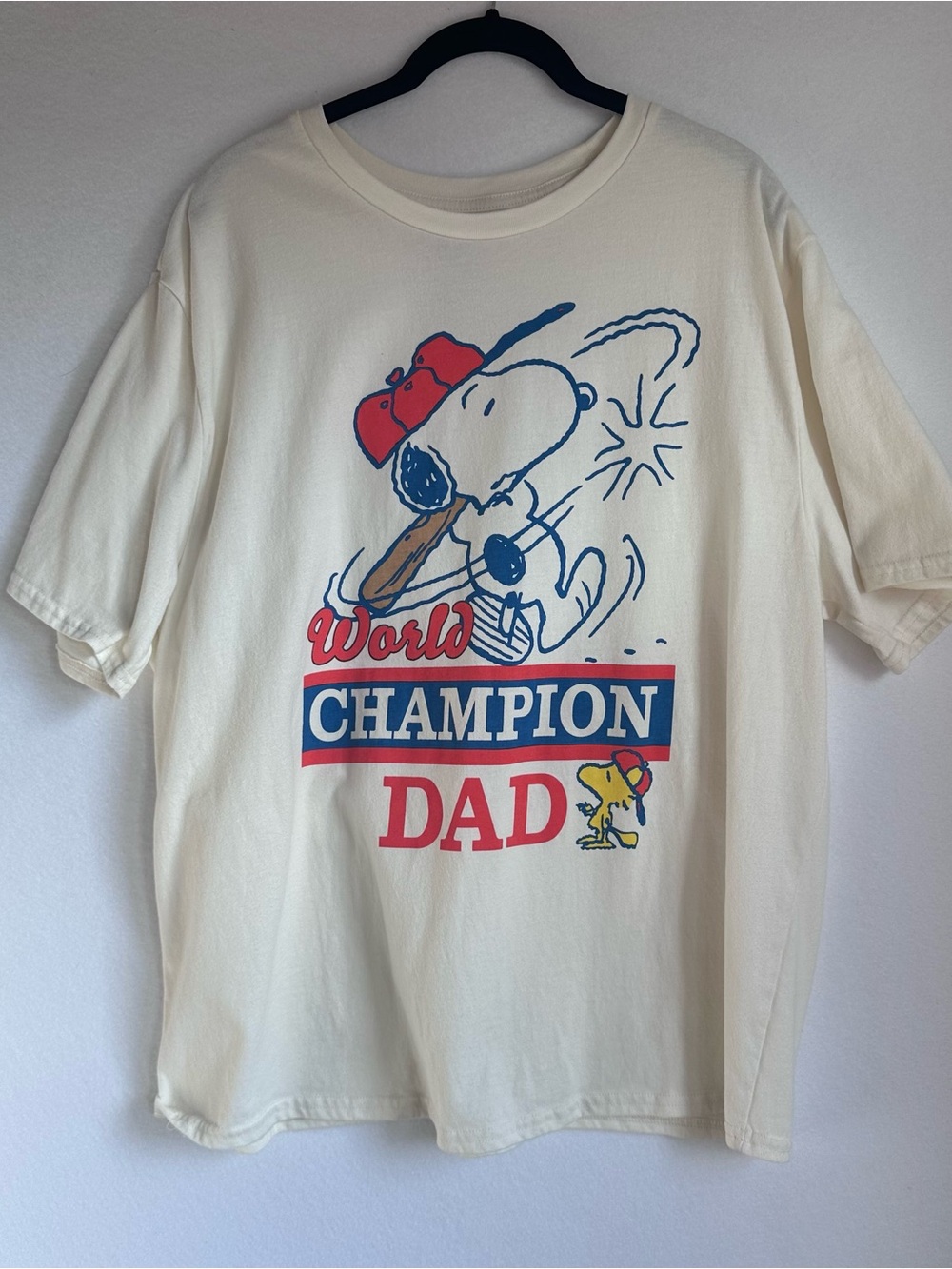 Peanuts Cream Snoopy "World Champion Dad" Graphic Tee with Red & Blue Accents